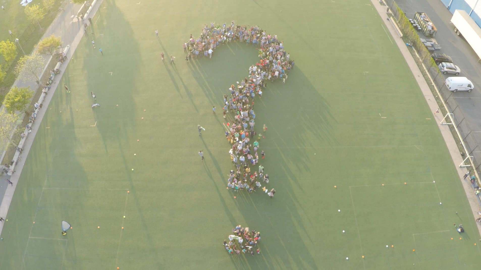 flash mob question mark on soccer field aerial shot